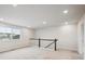 Light-filled hallway with soft carpet and modern railings offer an open view at 9996 Racine St, Commerce City, CO 80022