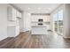Modern kitchen featuring white cabinetry, an island, and stainless steel appliances at 9996 Racine St, Commerce City, CO 80022