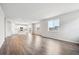Bright and airy living room with lots of natural light and beautiful wood-look flooring at 9996 Racine St, Commerce City, CO 80022