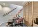 Basement desk area with stairs and closet, offering a functional workspace at 2886 S Acoma St, Englewood, CO 80110
