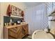 Stylish bathroom featuring a modern vanity and patterned shower curtain at 2886 S Acoma St, Englewood, CO 80110