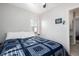 Well-lit bedroom with hardwood floors and a view of the en-suite bathroom at 2886 S Acoma St, Englewood, CO 80110