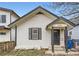 Charming home featuring an inviting front porch and classic architectural details at 2886 S Acoma St, Englewood, CO 80110