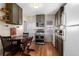 Charming eat-in kitchen featuring stainless steel appliances and updated cabinetry at 2886 S Acoma St, Englewood, CO 80110
