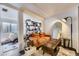 Relaxing living room area with a comfortable couch, shelving, and a mirror at 2886 S Acoma St, Englewood, CO 80110