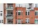 Brick building features private balconies with outdoor seating, offering residents a relaxing outdoor living space at 2897 W Riverwalk Cir # 204, Littleton, CO 80123