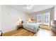 Inviting bedroom with natural light from the large windows and hardwood floors at 2897 W Riverwalk Cir # 204, Littleton, CO 80123
