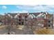 Attractive brick multi-Gathering exterior with balconies and well-maintained landscaping at 2897 W Riverwalk Cir # 204, Littleton, CO 80123