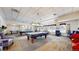 Recreation room features a pool table, ping pong table and comfortable seating, perfect for leisure and social gatherings at 2897 W Riverwalk Cir # 204, Littleton, CO 80123