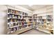 Cozy library corner with fully stocked bookshelves and selection of games for relaxed reading and entertainment at 2897 W Riverwalk Cir # 204, Littleton, CO 80123