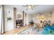 Inviting living room with a brick fireplace, hardwood floors, and comfortable seating at 2897 W Riverwalk Cir # 204, Littleton, CO 80123