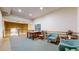 Shared lounge area with sitting area, carpeting and overlooking lower level at 2897 W Riverwalk Cir # 204, Littleton, CO 80123