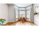 Inviting sitting area with a bay window, filling the space with abundant natural light at 2897 W Riverwalk Cir # 204, Littleton, CO 80123