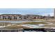 Scenic view of the community from the balcony including a pond and golf course at 2897 W Riverwalk Cir # 204, Littleton, CO 80123