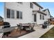 Inviting backyard with a patio, outdoor seating, grill, and well-manicured lawn at 1408 Brookfield Pl, Lafayette, CO 80026