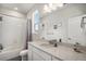 Well lit bathroom with white walls and counter tops at 1408 Brookfield Pl, Lafayette, CO 80026