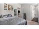 Relaxing bedroom features modern art, stylish furnishings, and en suite bathroom at 1408 Brookfield Pl, Lafayette, CO 80026