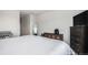 Cozy bedroom showcases a TV, dresser, and convenient storage units at 1408 Brookfield Pl, Lafayette, CO 80026