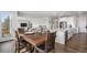Open-concept dining room connected to the kitchen and living spaces at 1408 Brookfield Pl, Lafayette, CO 80026