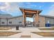 Inviting community entrance with modern architecture and manicured landscaping at 1408 Brookfield Pl, Lafayette, CO 80026