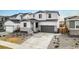 Charming two-story home featuring a two-car garage and well-maintained front yard at 1408 Brookfield Pl, Lafayette, CO 80026