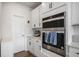 Stainless steel double oven with white cabinets and sleek countertops for a modern cooking experience at 1408 Brookfield Pl, Lafayette, CO 80026