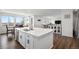 Bright and airy kitchen with a large island, dining area, and stainless steel appliances at 1408 Brookfield Pl, Lafayette, CO 80026