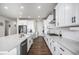 Modern kitchen featuring white cabinetry, stainless steel appliances, and ample counter space at 1408 Brookfield Pl, Lafayette, CO 80026