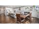 Bright kitchen featuring an island with bar seating, stainless steel appliances, and a dining area at 1408 Brookfield Pl, Lafayette, CO 80026
