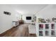Bright living room featuring hardwood floors, natural light, and stylish furniture, offering a cozy atmosphere at 1408 Brookfield Pl, Lafayette, CO 80026