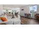 Open-concept living area with a large window, comfortable seating, and views of the neighborhood at 1408 Brookfield Pl, Lafayette, CO 80026