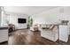 Open living area with hardwood floors and plenty of space for seating at 1408 Brookfield Pl, Lafayette, CO 80026