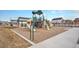 Community playground area with slides, playground equipment, and seating at 1408 Brookfield Pl, Lafayette, CO 80026