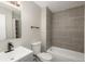 Modern bathroom features tiled walls, sleek fixtures, and updated vanity at 18071 E Kentucky Ave # 203, Aurora, CO 80017