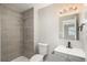 Modern bathroom features tiled walls, sleek fixtures, and neutral vanity at 18071 E Kentucky Ave # 203, Aurora, CO 80017