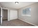 Bedroom features neutral colors, window and closet with sliding doors at 18071 E Kentucky Ave # 203, Aurora, CO 80017
