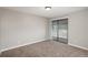 Bedroom features sliding glass doors to a balcony with carpet flooring at 18071 E Kentucky Ave # 203, Aurora, CO 80017