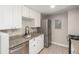 Kitchen featuring white cabinets, granite countertops, and stainless steel appliances at 18071 E Kentucky Ave # 203, Aurora, CO 80017