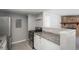Well-lit kitchen features stainless steel appliances, light granite countertops, and white cabinets at 18071 E Kentucky Ave # 203, Aurora, CO 80017