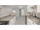 Well-lit kitchen features stainless steel appliances, light granite countertops, and white cabinets at 18071 E Kentucky Ave # 203, Aurora, CO 80017