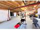 Large basement area with exposed beams, exercise machines, and workout space at 2305 Dogwood Cir, Erie, CO 80516