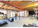Spacious basement with exercise equipment and exposed ceiling, perfect for a home gym at 2305 Dogwood Cir, Erie, CO 80516