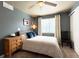 Comfortable bedroom features a large window and soft natural light at 2305 Dogwood Cir, Erie, CO 80516
