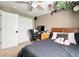 Bedroom with ceiling fan, carpet floors, closet space and bedside work space at 2305 Dogwood Cir, Erie, CO 80516