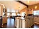 Spacious kitchen with a center island, stainless steel appliances, and an open layout to the living area at 2305 Dogwood Cir, Erie, CO 80516