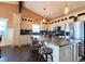 Spacious kitchen with stainless steel appliances, a large island, and stylish pendant lighting at 2305 Dogwood Cir, Erie, CO 80516