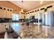 Kitchen island featuring granite countertops with overhead lights and stainless appliances at 2305 Dogwood Cir, Erie, CO 80516