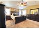 Spacious main bedroom with a ceiling fan, ample closet space, and modern decor at 2305 Dogwood Cir, Erie, CO 80516