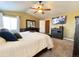 Spacious main bedroom with a ceiling fan, ample closet space, and modern decor at 2305 Dogwood Cir, Erie, CO 80516