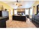 Spacious main bedroom with a ceiling fan, ample closet space, and modern decor at 2305 Dogwood Cir, Erie, CO 80516
